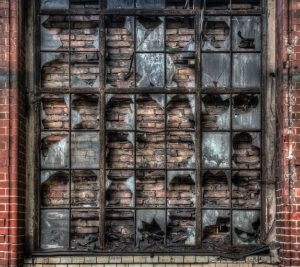 Window towards a brick wall in the northern power house of Beelitz Heilstätten
